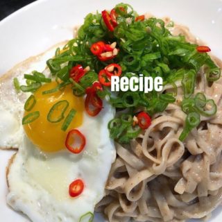 Wow, so apparently it was a whole YEAR ago that I posted my first #quarantinekitchen recipe ? seems fitting to share it again! What I loved about this dish is that the ingredients are typically already in the cupboards + fridge, + it’s so easy to throw together. 

Sesame-Garlic Noodles w Eggs

Serves 2 200g Dried Noodles, not too thick 2 tbsp Sesame Oil

Sesame Sauce  2 tbsp Tahini 1 tbsp Sesame Oil 2 tbsp Soy Sauce 4 tbsp Warm Water 1/8 tsp Chinese Five Spice Powder pinch of Salt, to taste
2 cloves Garlic, peeled and grated w microplane 
To Finish
1 tsp Oil
1-2 Eggs, per person Red Chili, sliced (optional) Green Onion, sliced

Instructions

1.) for sesame sauce, combine tahini, sesame oil, soy sauce, water, five spice, salt, + garlic. Stir until well combined.
2.) cook the noodles for 4-5 minutes or until just tender (or however long the package recommends). Drain and put into mixing bowl; mix with a couple teaspoons sesame oil (to prevent sticking)
3.) heat the 1 teaspoon oil in a small nonstick frying pan over medium heat. Crack the eggs into the pan, cover with a tight lid and cook, uninterrupted, until the whites are completely set but the yolks are still runny, 2 to 2 1/2 minutes. 
4.) meanwhile, mix the noodles w the sauce until combined. Place into bowl or plate, and slide the eggs on top. Sprinkle everything with the scallions and chili (if using). Enjoy
