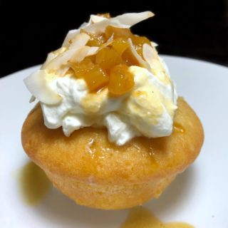 The most amazingggg Rum Cake soaked in Rum Syrup, with Cream, Caramelized Pineapple, + Crispy Coconut ?